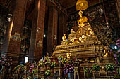 Bangkok Wat Pho, altar of the ubosot with statues of Buddha and disciples. 